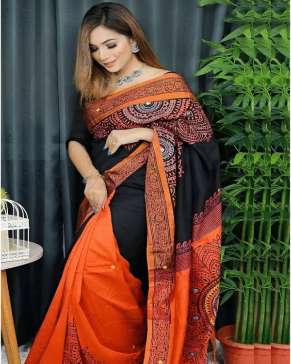 আলাদা ব্লাউজ পিস সহ কমলা ডলার ধুপিয়ান প্রিন্ট শাড়ী